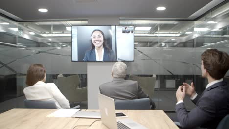 Businesspeople-having-video-conference-in-boardroom